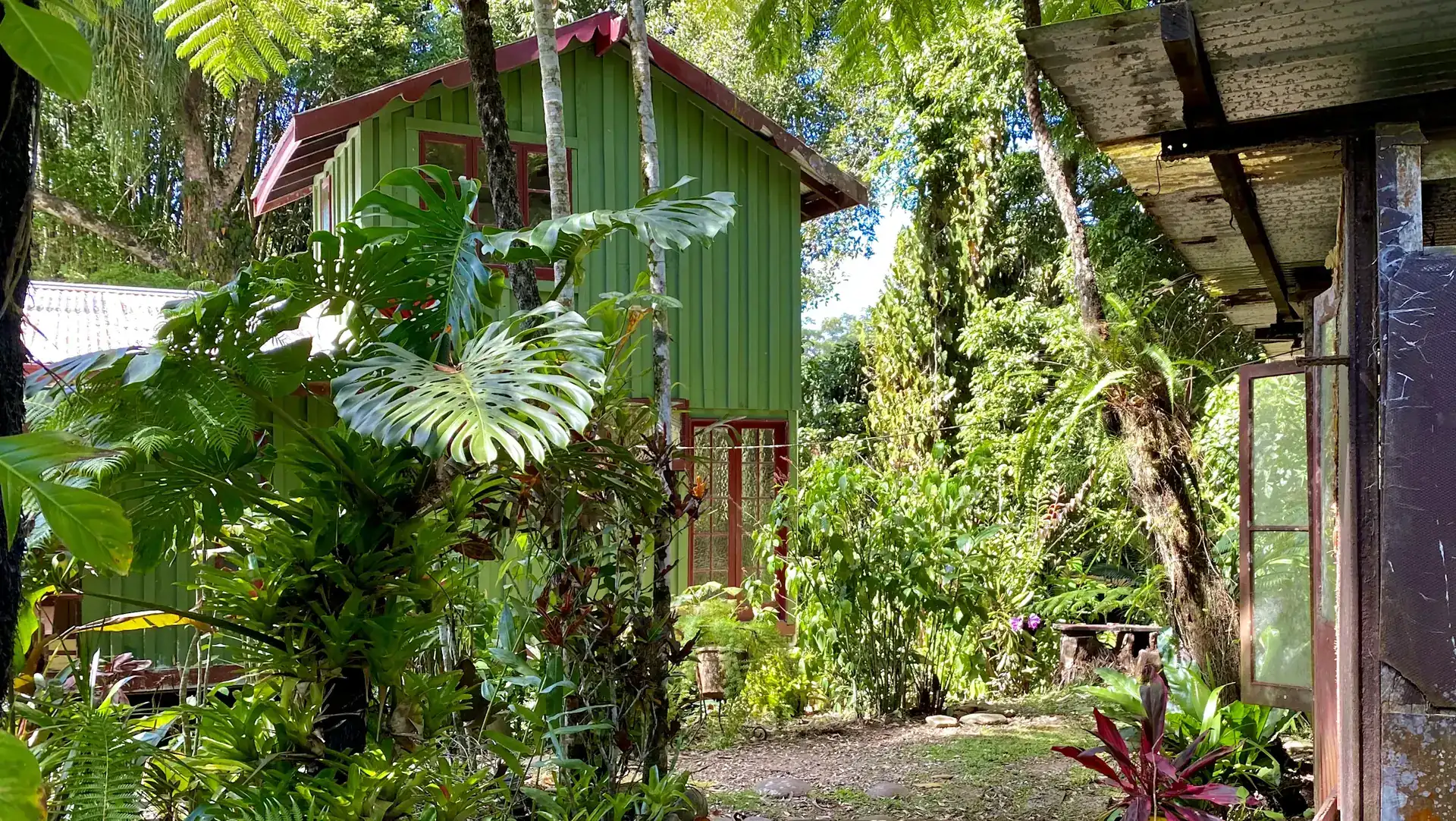 A timber house among tropical gardens